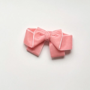 Pink velvet oversized bow hair clip with white edge detail for girls and toddlers
