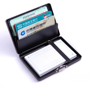 Internal view of the black metal card case showing layers for business cards and IDs