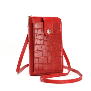 Sleek red crocodile pattern crossbody phone bag with slim shoulder strap and metal snap