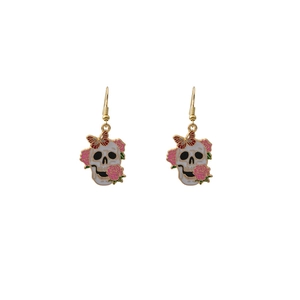 Detail view of gothic skull earrings with pink rose and red butterfly enamel dangles