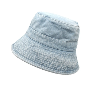 Detailed close-up of light blue washed denim bucket hat with vintage stitching finish