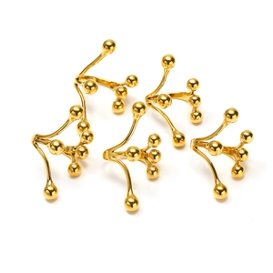 Close-up of five 18k gold plated titanium steel rings with abstract bead branch design