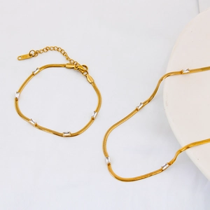 18K gold plated titanium steel snake chain set with zircon stones on white background