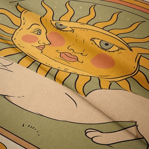 Detail shot of the sun and moon tapestry showing soft velvet texture and vintage printing