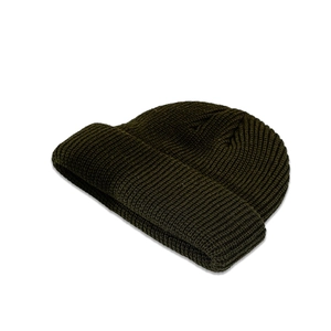 Detailed view of the dark olive green ribbed knit texture on a winter beanie hat
