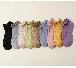 Flat lay display of colorful heart jacquard ankle socks with sweet ruffled lettuce edges