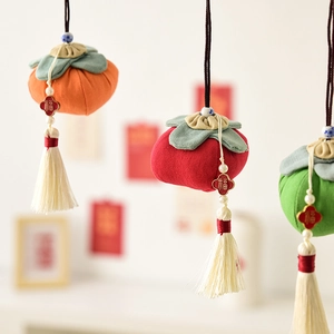Handmade fabric persimmon hanging ornaments with tassels for festive holiday decoration
