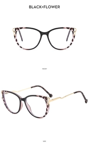 Detail view of cat eye glasses with black flower frames and wavy golden metal temples
