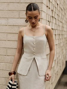 Elegant oatmeal cotton linen two-piece set featuring button-up vest and slit skirt