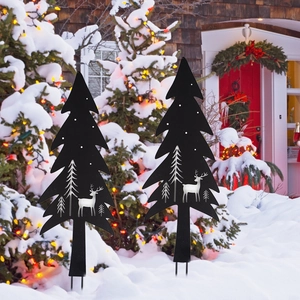 Set of 2 black metal Christmas tree stakes with reindeer and pine tree cutout for garden decor