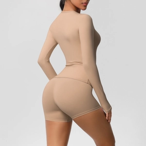 Detail of skin-friendly brushed fabric on seamless yoga set with high-waist shorts