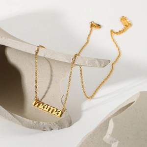 Detail of 18K gold-plated titanium steel necklace with a 'mama' letter pendant