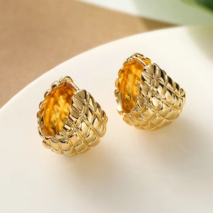 Elegant gold plated geometric earrings with quilted pattern in a minimalist metal style