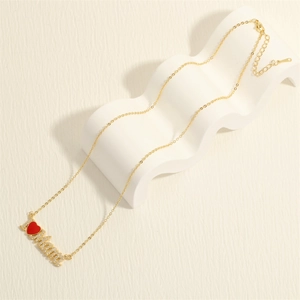 Detailed view of the I Love Mama gold necklace with sparkling crystals and red heart