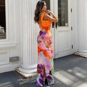 Detail view of floral print backless maxi dress with high side slit and satin finish