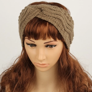 Detail of coffee brown knitted twist headband with chunky texture and fleece lining