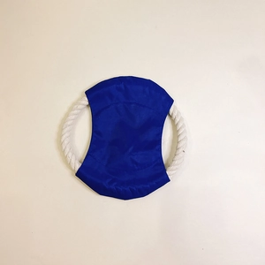 Detail of durable blue fabric pet flying disc and white cotton rope handles for dogs