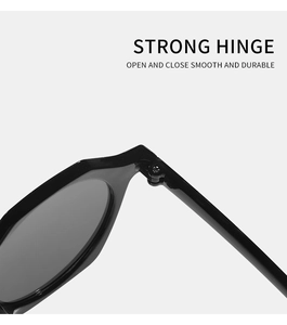 Close-up of durable metal hinge on black sunglasses for smooth opening and closing