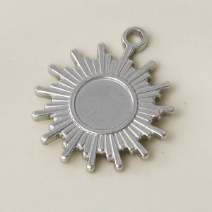 Detailed view of sunburst pendant made of polished 304 stainless steel with top link ring