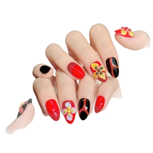 Faux ongles amande faits main rouge et noir avec motifs de fleurs en relief 3D