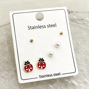3-pack stainless steel stud earrings set with ladybug, pearl, and gold bead designs