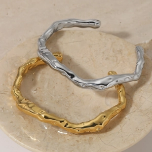 Gold and silver 316 stainless steel open bracelets with irregular lava texture finish