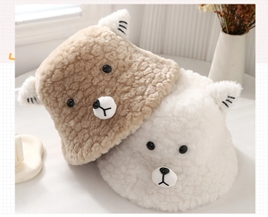 Detail of plush teddy bear bucket hats showing soft faux shearling texture and cute 3D ears