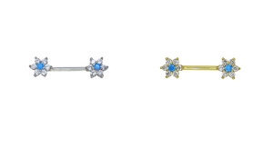 Detailed view of silver and gold floral nipple rings with blue zircon and clear crystals