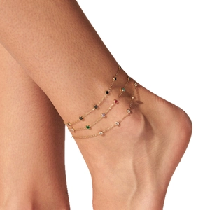 Multi-layer gold stainless steel anklet with colorful round crystal charms on a model
