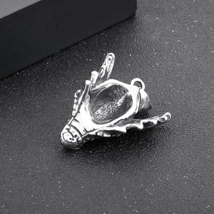 Retro punk dragon head pendant in silver stainless steel with detailed metal textures
