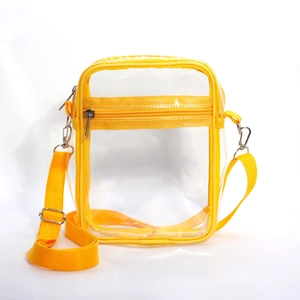 Detail view of transparent PVC crossbody bag with vibrant yellow trim and adjustable strap