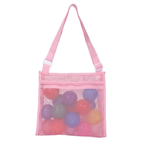 Detailed view of pink mesh beach bag with adjustable strap and smooth zipper closure