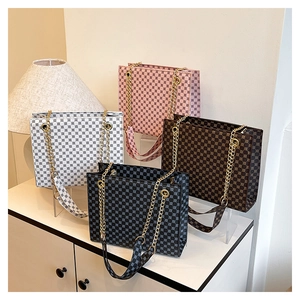 Collection of chic tote bags with all-over logo prints and detachable patterned straps