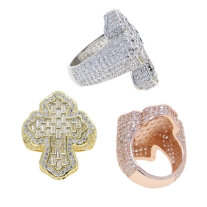 Detailed view of hip-hop cross rings in gold, silver, and rose gold with pavé zircon