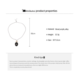 Detail showing wood and acrylic Saturn pendant with dimensions 95cm and 12.3g weight
