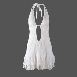 Detailed view of white lace texture and halter neck design on backless tiered dress