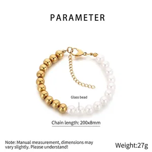 Detail view of 8mm golden beads and white glass pearls bracelet with lobster clasp and chain