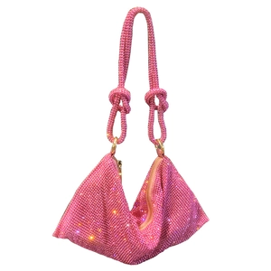 Pink rhinestone studded evening bag with triangular shape and braided handle detail