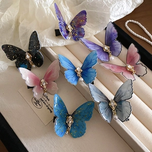 Barrettes papillon chics avec ailes en acrylique, strass brillants et pendentifs perles