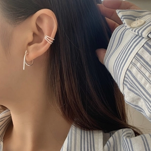 Close-up of S925 silver geometric hoop earrings and triple-layer pavé ear cuff set