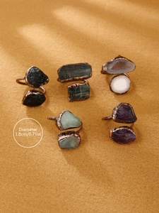 Detail showing vintage bronze rings with raw natural stones and 1.8cm diameter size spec