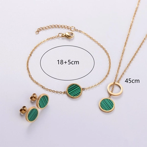 Detailed view of 18K gold-plated stainless steel jewelry set with green striped circular charms