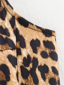 Close-up of leopard print pattern and neat stitching on a summer A-line dress