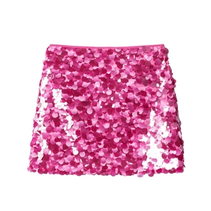 Detail of pink sequins on a knit midi skirt showing rich texture and glossy finish