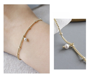 Detail view of S925 sterling silver bead chain bracelet with a white round pearl