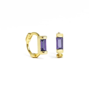 Macro detail of S925 sterling silver gold earring with emerald-cut purple gemstone