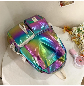 Detail of laser reflective backpack featuring multi-pocket design and buckle closure