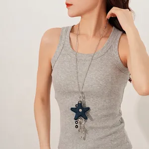 Titanium steel necklace with blue denim star pendant and music notes on female model