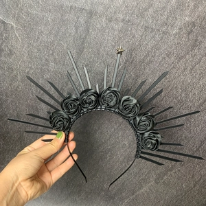 Detailed view of Gothic black rose halo headband featuring sharp spikes and silver star