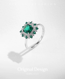 Close-up of S925 silver emerald ring showing exquisite halo setting and clear metal stamp
